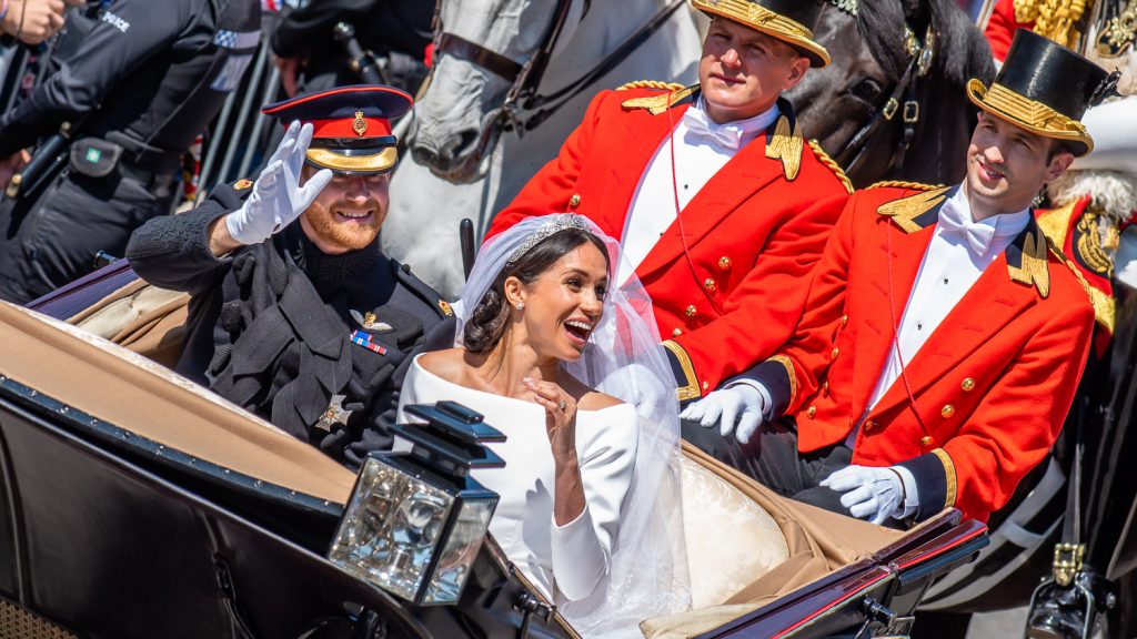 Meghan laughs in carriage parade