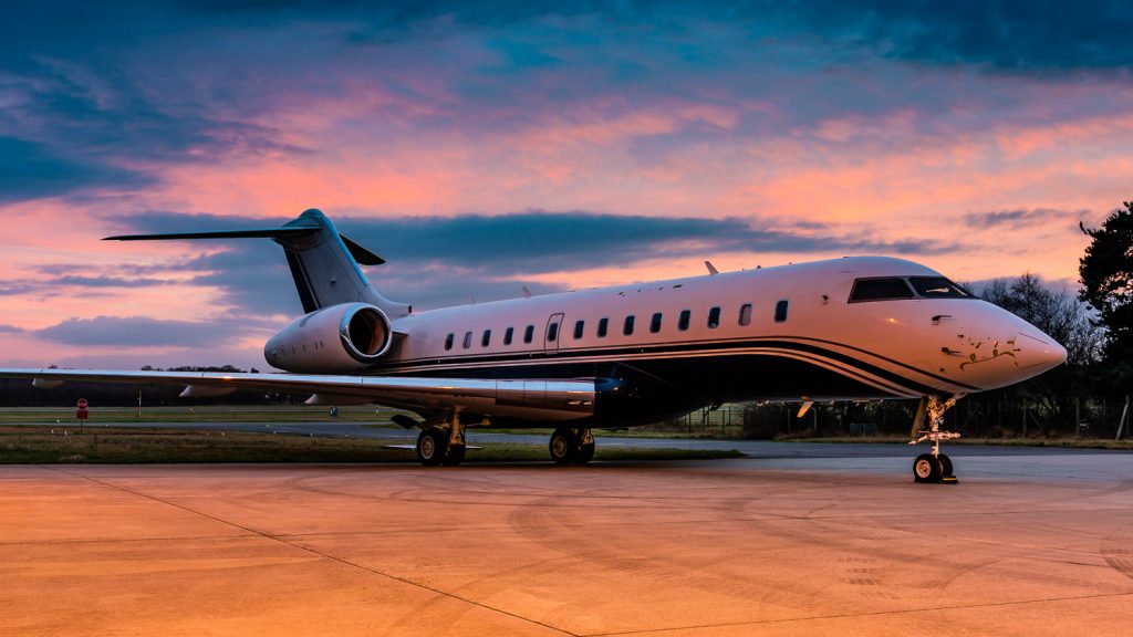 private jet at sunset