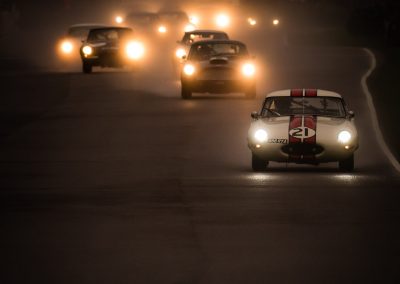 classic racing cars with lights on