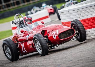 red racing car lifts wheel