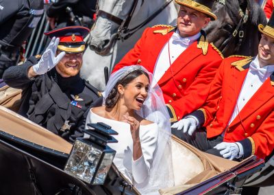 Meghan laughs in carriage parade
