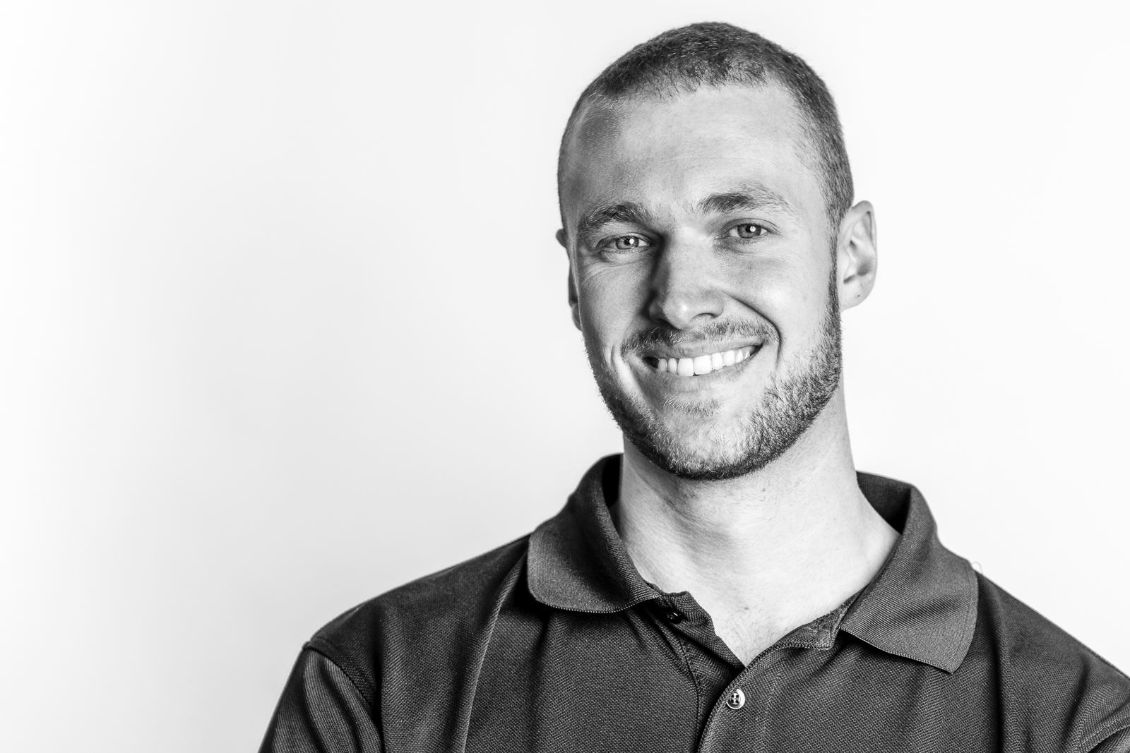 man-smiling-headshot-photography-monochrome