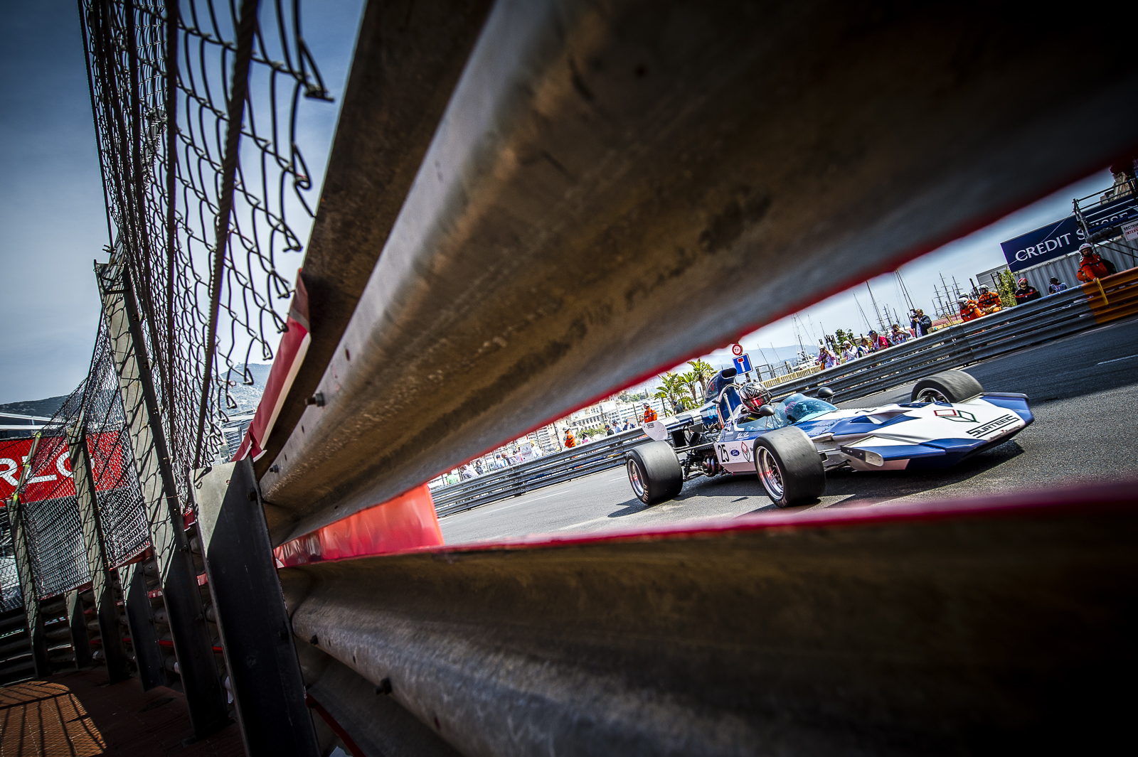 racecar-through-barrier-monaco-grand-prix-motorsport-photography