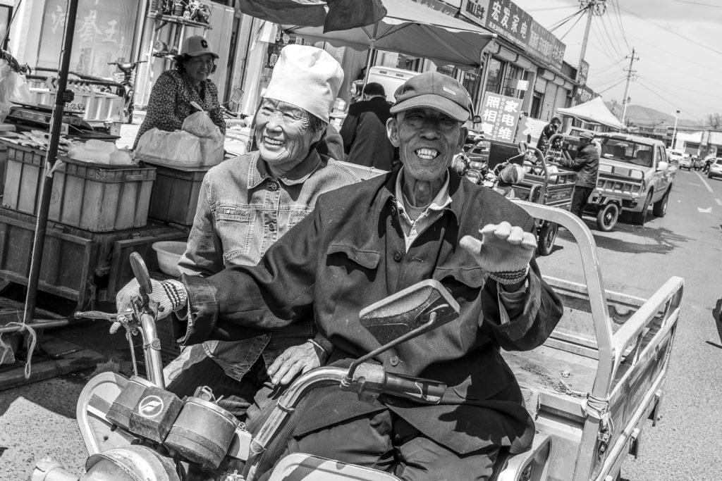 Older Chinese couple on their tut-tut