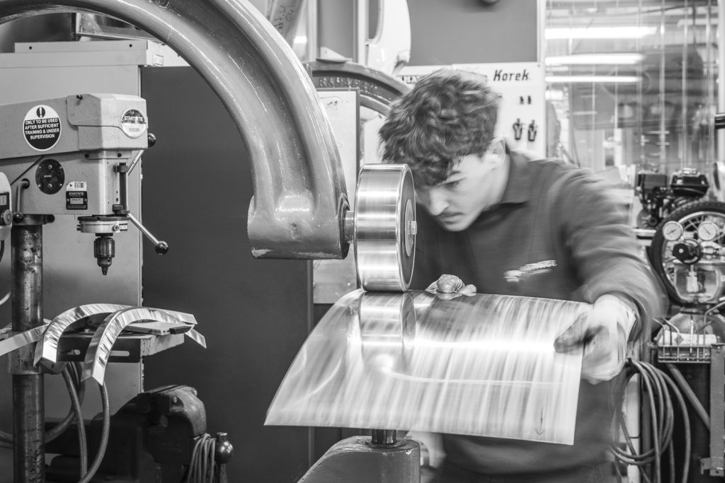 student using an English Wheel