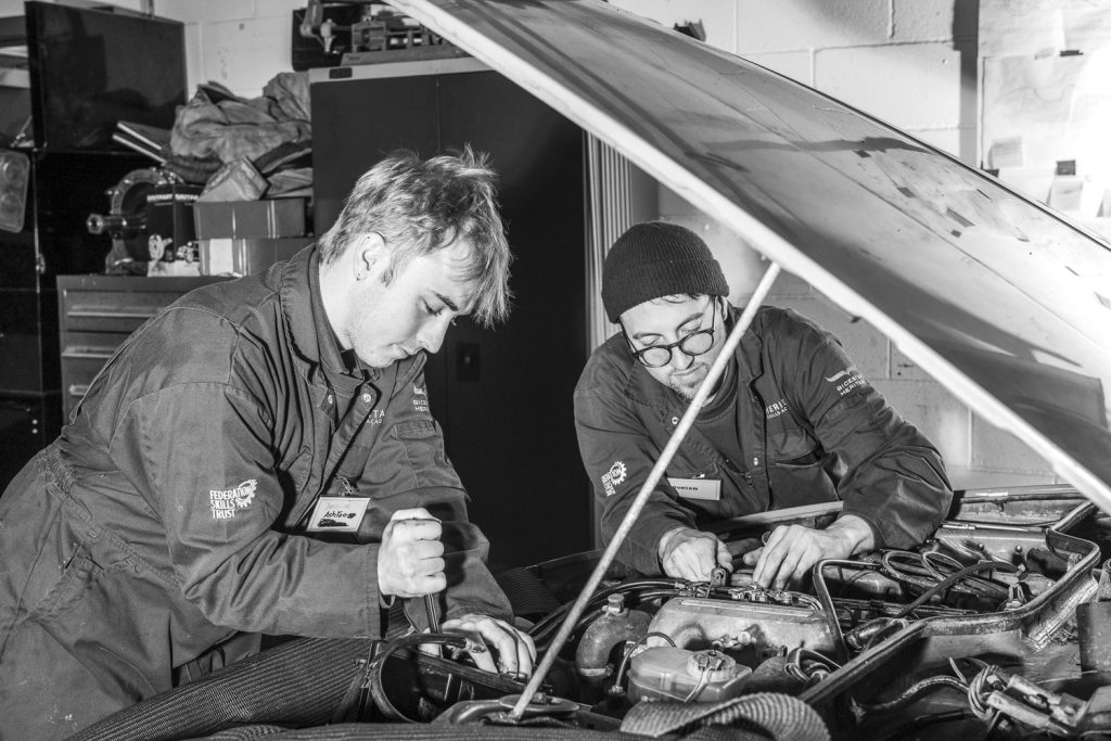 students working on engine