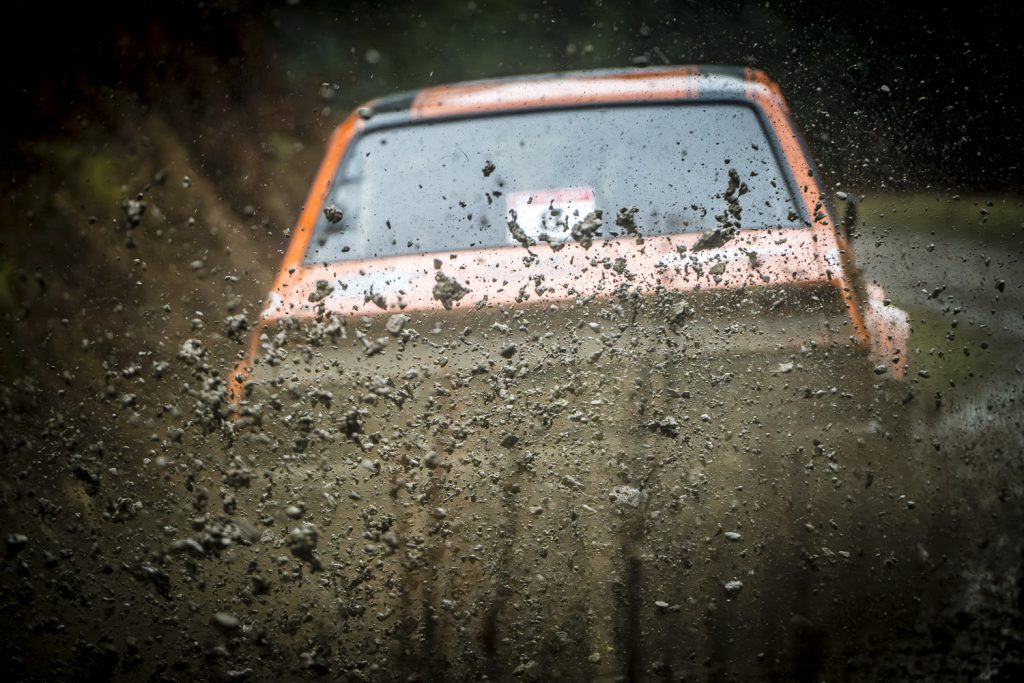 rally car throws mud