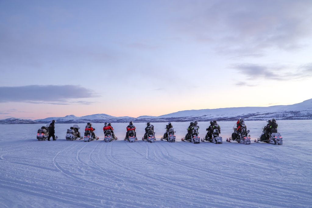 snowmobiles on frozen lake