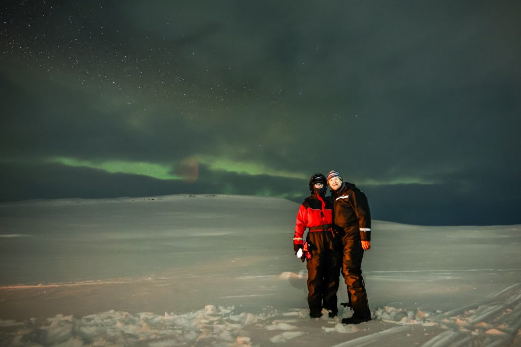 northern lights on snowy mountain